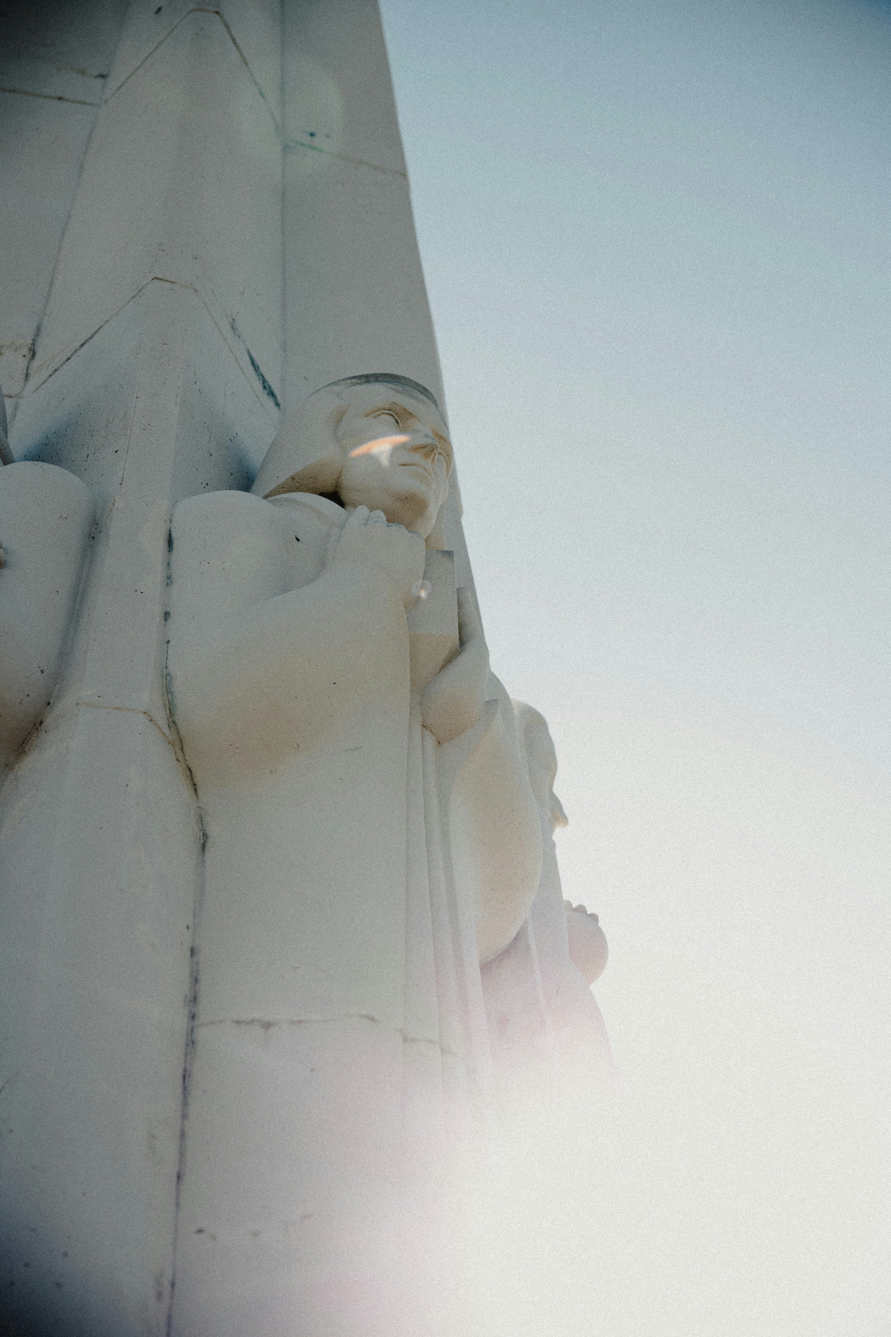 white concrete statue under blue sky during daytime